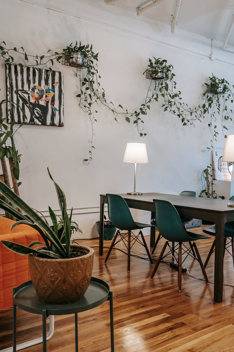 Interior design of spacious living room with table and sofa